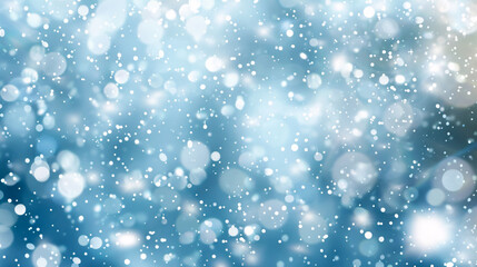 Artistic winter snowfall bokeh background with sparkle. Silver and soft blue colors for a Christmas or New Year greeting card.