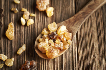 Frankincense or boswellia resin on wooden spoon