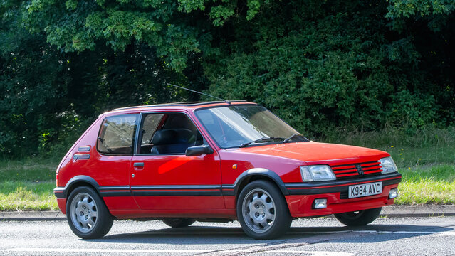 1990 red PEUGEOT 205 car,