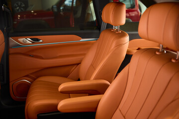 Indulge in Luxurious Orange Leather Car Seats that feature a Unique and Stylish Design