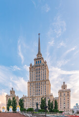 high-rise stalinist building near river at summer sunset in Moscow, Russia. Historic name is Hotel Ukraine.