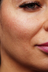 Fototapeta premium Close-up view of a woman's striking blue eyes with long lashes