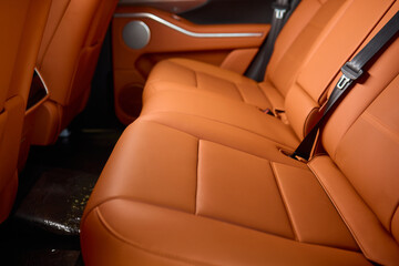 Indulge in Luxurious Orange Leather Car Seats that feature a Unique and Stylish Design
