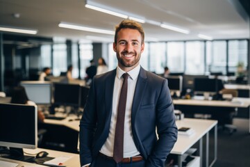 Obraz premium Smiling portrait of a young Caucasian businessman in modern office