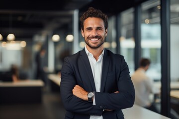Fototapeta premium Smiling portrait of a young Caucasian businessman in modern office