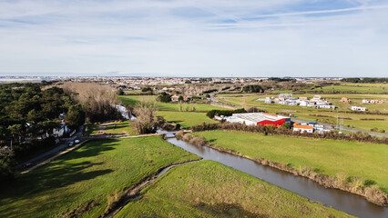 Naklejka premium Aerial drone view of a flood zone along the Jaunay River near Givrand, France on a beautiful winter day