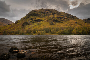 Fototapeta premium A cold, cloudy, autumnal HDR image of the remote, Loch Eilt, separating Morar and Moidart in Lochaber, Scotland.