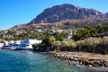 Fototapeta premium View over the coast of Myrties, Kalymnos, Greece to the famous climbing rocks
