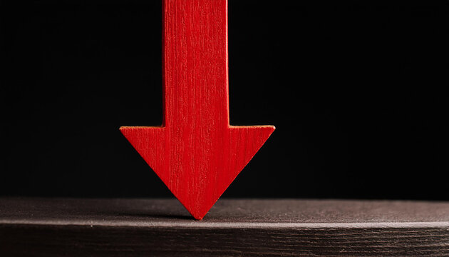Red wooden arrow pointing down on black background. Business, market decline or economic