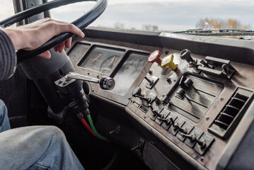 Interior View of an Old Semi Truck Dashboard: Dusty Controls for Air Brakes, Cruise Control, with...