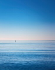 Fototapeta premium Sailboat sailing in the open ocean on a clear day
