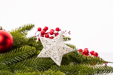 Christmas Decoration ornaments on white background, Closeup image of Star and fir branch