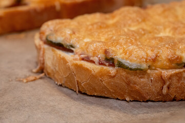 Cheesy Open-Faced Sandwich on Baking Paper
