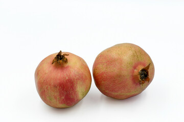 Two pomegranate fruits isolated on whte background
