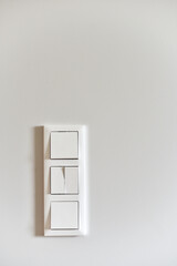 White switch on a light wall