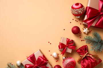 Christmas or winter holidays decor and gifts on a beige background. Flat lay, top view, copy space.