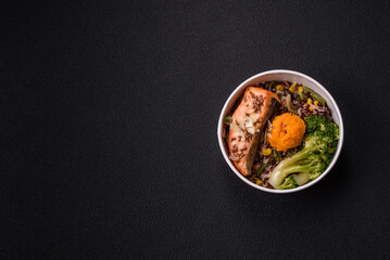 Grilled salmon with salt and spices, broccoli, tomatoes, rice