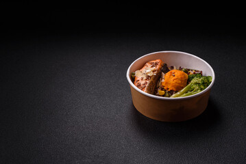 Grilled salmon with salt and spices, broccoli, tomatoes, rice