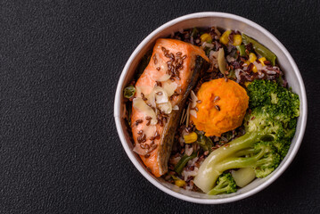 Grilled salmon with salt and spices, broccoli, tomatoes, rice