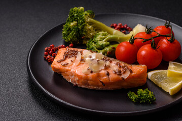 Grilled salmon with salt and spices, broccoli, tomatoes, rice