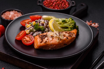 Grilled salmon with salt and spices, broccoli, tomatoes, rice