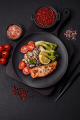 Grilled salmon with salt and spices, broccoli, tomatoes, rice