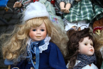 porcelain doll with long hair on the old market