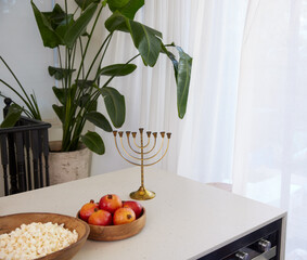 Table with a gold menorah, multibranched candelabra, used in the religious rituals of Judaism