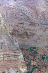Close-up of rugged cliff face showcasing textured layers of eroded rock