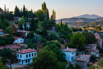 Sirince is a neighbourhood in Selcuk, İzmir Province, Turkey. Aerial drone view of ancient village Sirince. Beautiful landscape of Sirince with traditional historical houses.