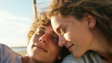 Fototapeta premium Joyful teenage couple enjoying a relaxing day outdoors in sunlight