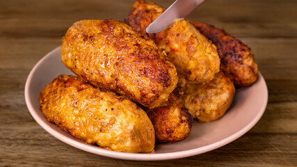 Golden brown chicken rolls on a plate