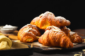 Chocolate croissants on a dark background side view