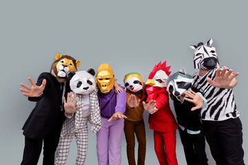Photo of zebra gorilla raccoon lion panda sloth rooster mask people embrace arms scare wave hi...