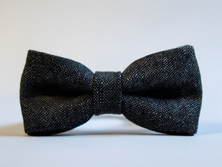 A classic black bow tie, perfect for a formal occasion.