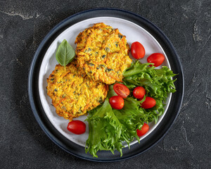 pumpkin carrot potato patties on plate, top view