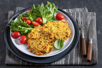 pumpkin carrot potato patties on plate, top view