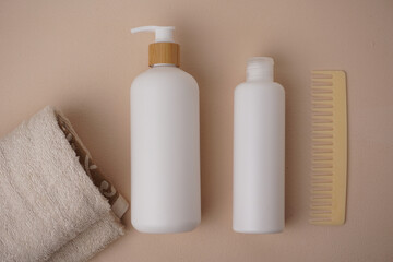Cosmetic bottle mockup, on a beige background, hand holding the bottle, mockup for branding your...