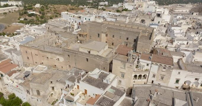 Aerial view of houses, apartments and buildings in the historic center of Ostuni in the province of Brindisi, in Puglia, Italy.