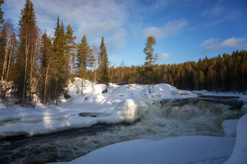 Winter landscape with a waterfall and snow. Russia, Karelia