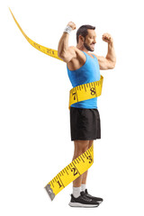 Fit man in sportswear flexing arm muscles and measuring body proportions