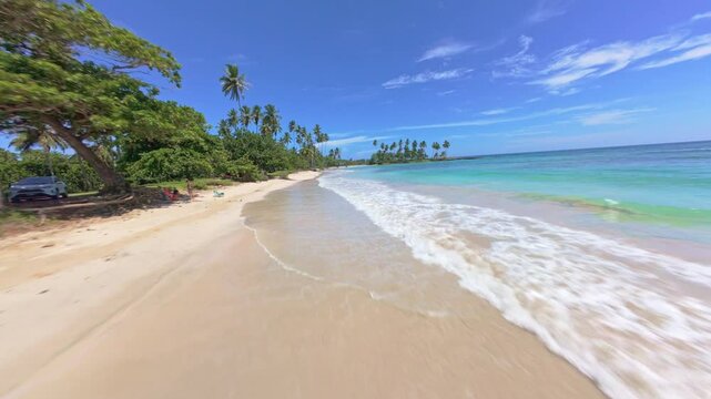 Paradise beach in Dominican Republic, FPV drone flying above it