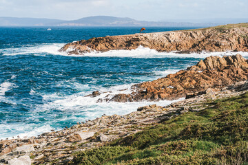 Rocky coastline with ocean waves in A Coruna, Spain