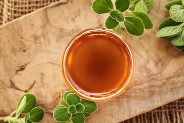 A bowl of homemade Plectranthus amboinicus syrup for common cold