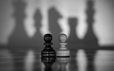 Chess pieces symbolize geopolitical and social relations. Their positions and shadows allow viewers to create their own metaphors and associations. Ideal for various descriptions of social relatitions