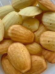 Freshly baked madeleine cookies, close up photo