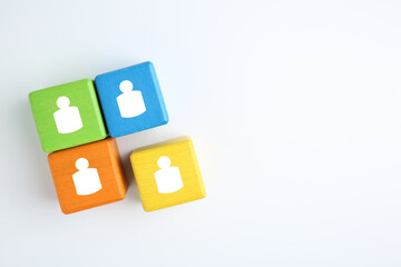 Obraz premium Human resource. Colorful cubes with human icons on white background, top view