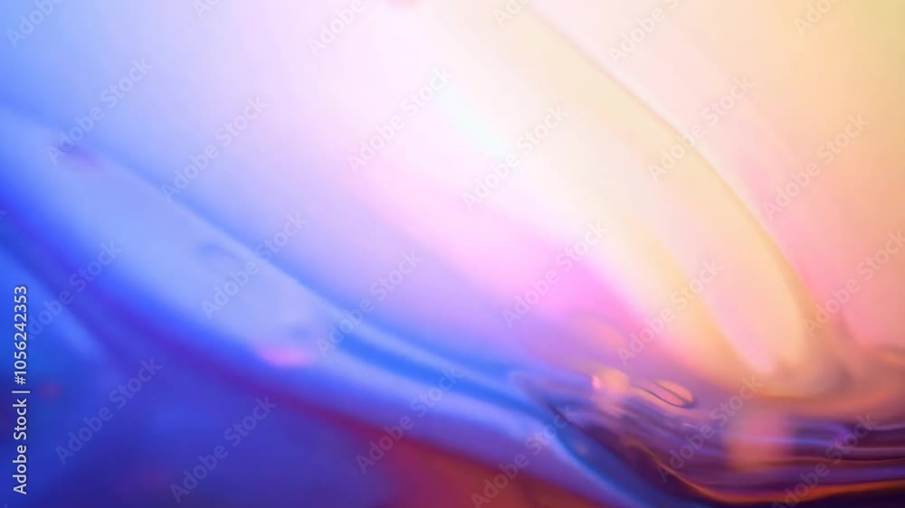 Poster colorful liquid paint mixes and forms beautiful shapes and bubbles, creating an abstract background 