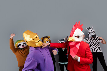 Photo of zebra raccoon lion panda sloth mask people gorilla rooster fight punch each other isolated...