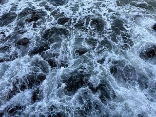 Sea waves drops on the rocks